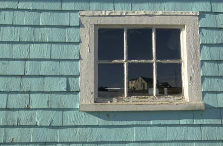 {building reflection in window