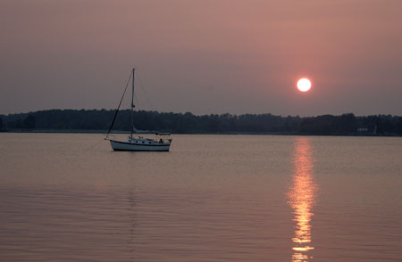 sunset boat on strand redder burned
